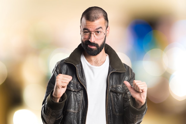 Man proud of himself on unfocused background