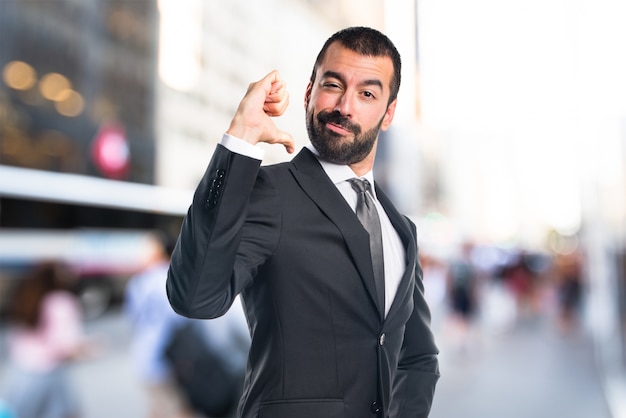 Man proud of himself on unfocused background