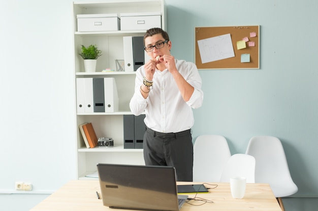 Man put bubble gum in his mouth in office