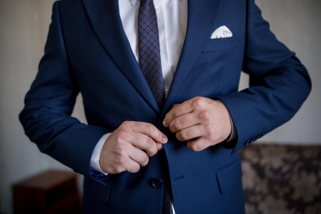 Man puts on a blue suit