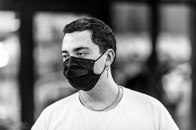 A man puts on a mask from a virus against coronavirus protection