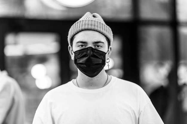 A man puts on a mask from a virus against coronavirus protection