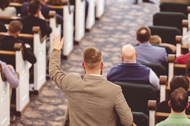 Man raising hand during a congregation in a church