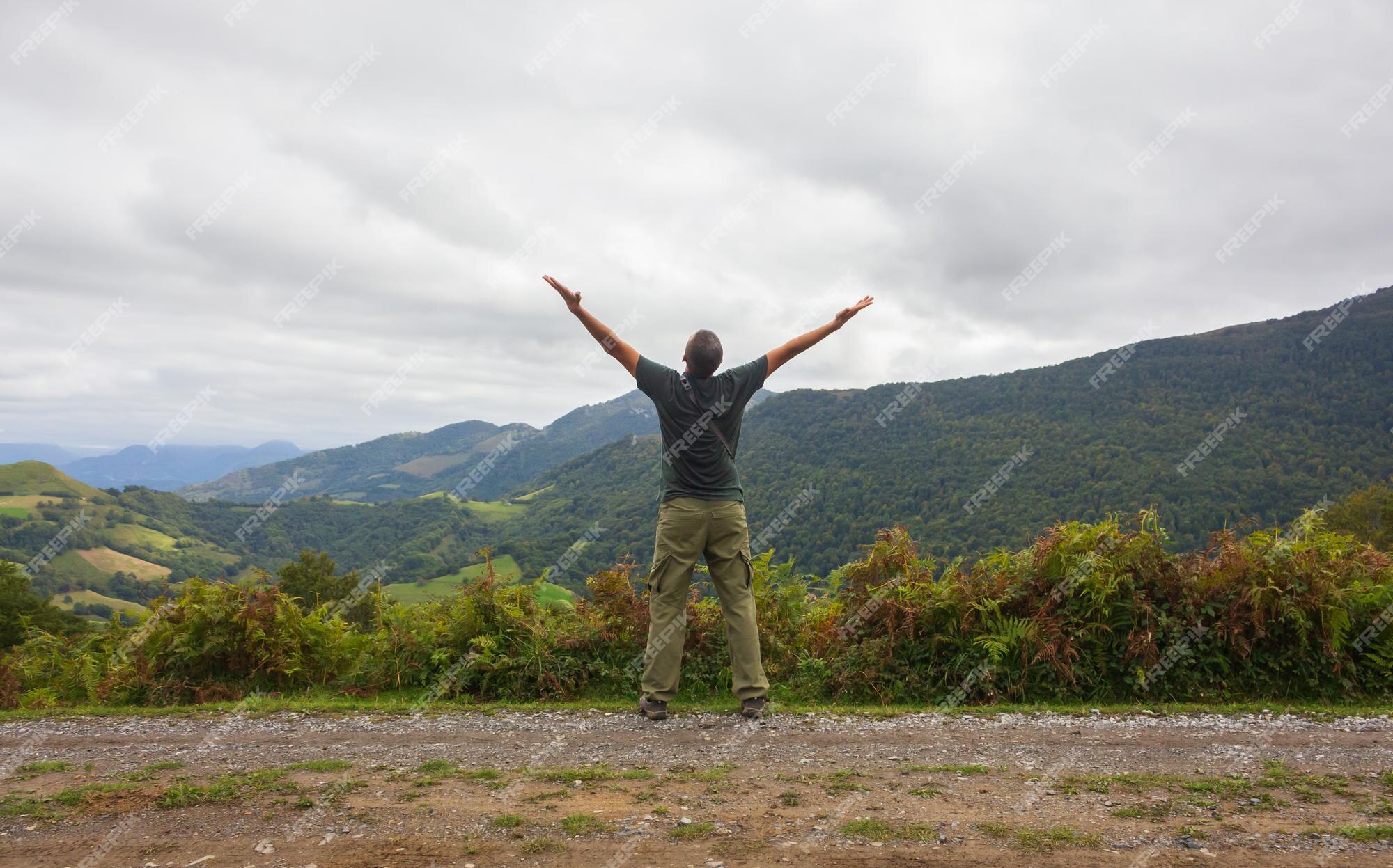 Premium Photo | Man raising hands on mountains background freedom concept wallpaper for laptop Premium Photo | Man raising hands on mountains background freedom concept wallpaper for laptop