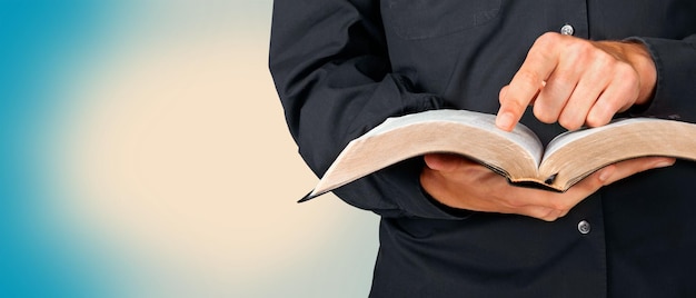 Man reading Bible on  background