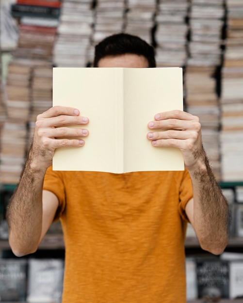 Man reading a book alone