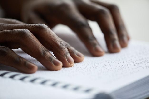 Man Reading Book in Braille Closeup