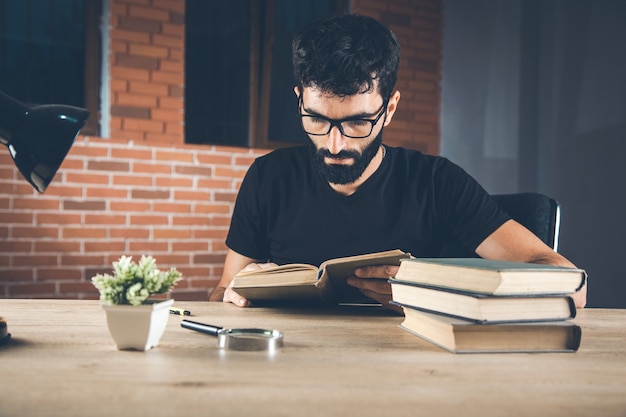 Man reading book in the office