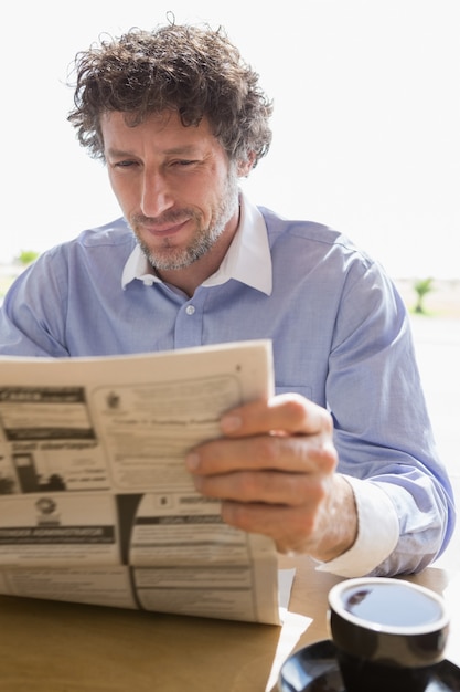 Man reading newspaper