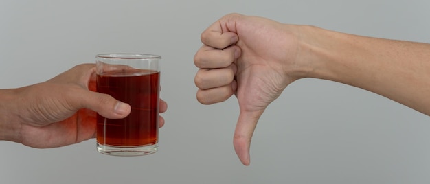 man refuses say no and avoid to drink an alcohol whiskey stopping hand sign male alcoholism treatment alcohol addiction quit booze Stop Drinking Alcohol Refuse Glass liquor unhealthy reject