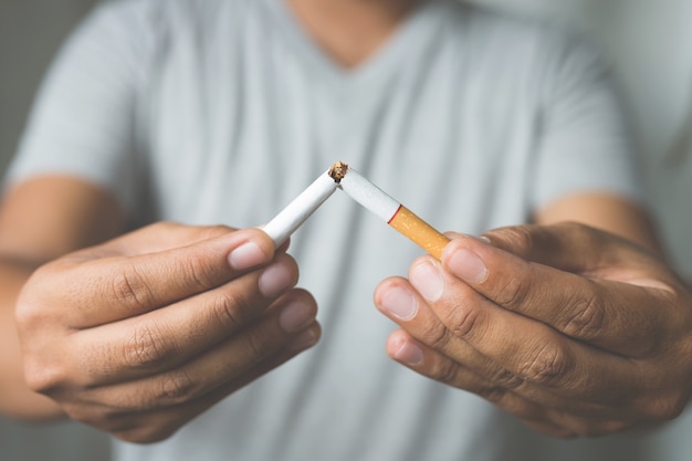 Man refusing cigarettes concept for quitting smoking and healthy lifestyle.