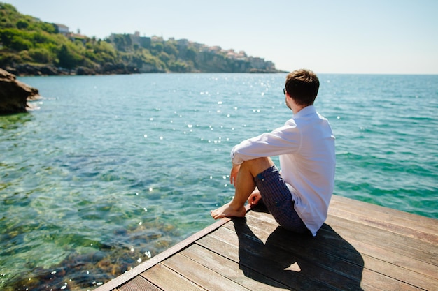 Man relax on beach with sea view. Montenegro.