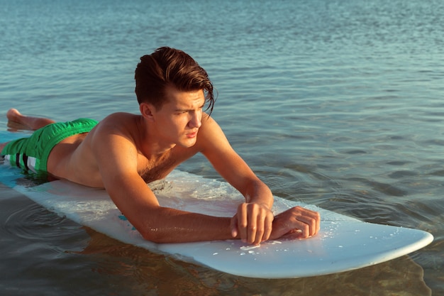 Man relaxing after surfing