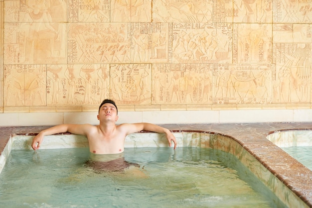 Man Relaxing Alone In Hot Tub