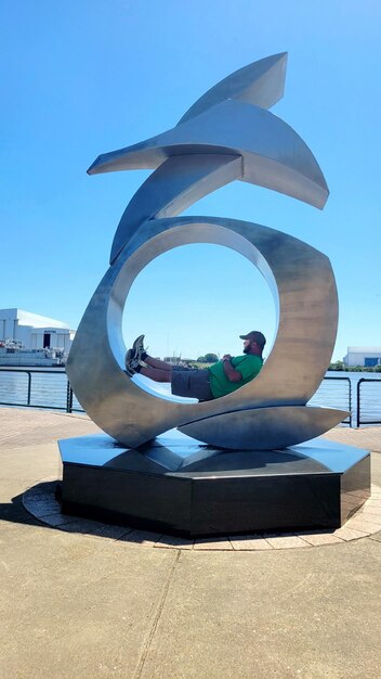 Man relaxing on a sculpture