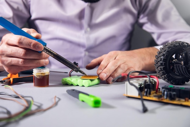 Man repair of a battery car toy