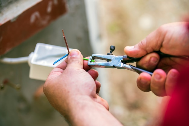 Man repairing electric installation