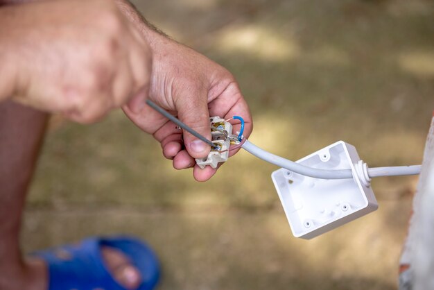 Man repairing electric installation