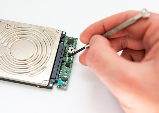 A man repairs a hard drive