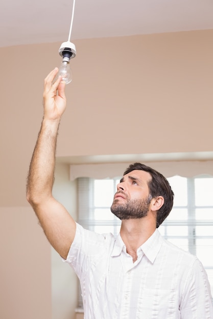 Man replacing the light bulb