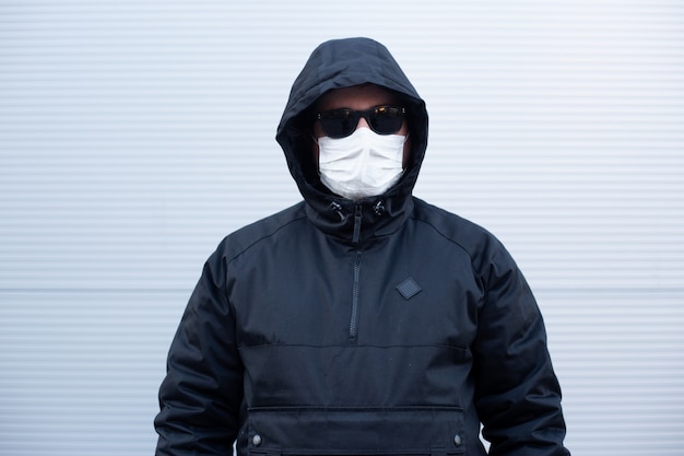 Man in a respirator to protect against infection with influenza virus or coronavirus