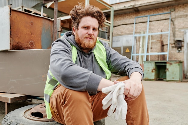 Man Resting after Scrap Metal