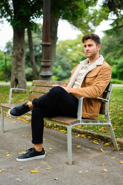 Man resting on bench in park