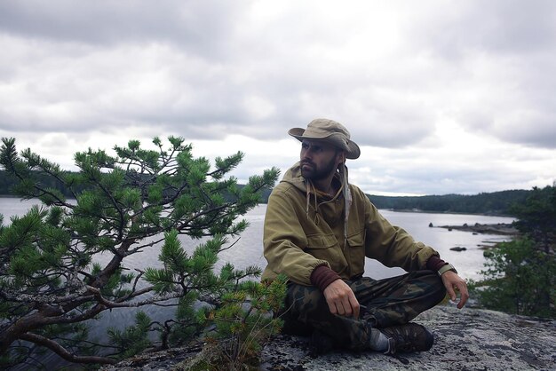 man resting in a hike