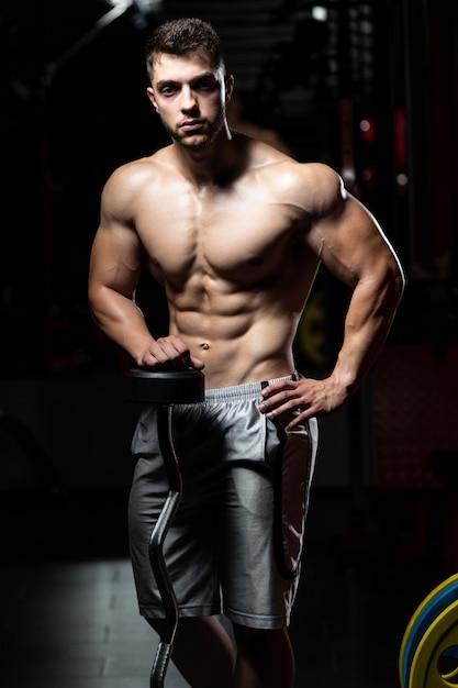 Man Rests In Gym After Having A Workout