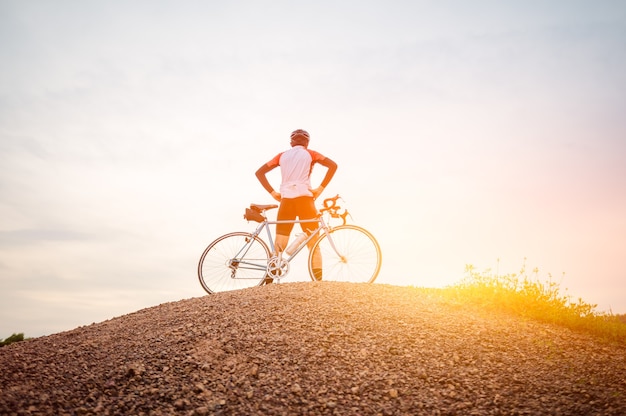 A man ride on bike on the Mountain Man riding vintage sports bike for evening exercise