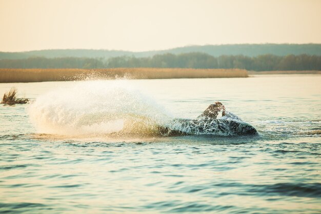 A man rides a hydrocycle