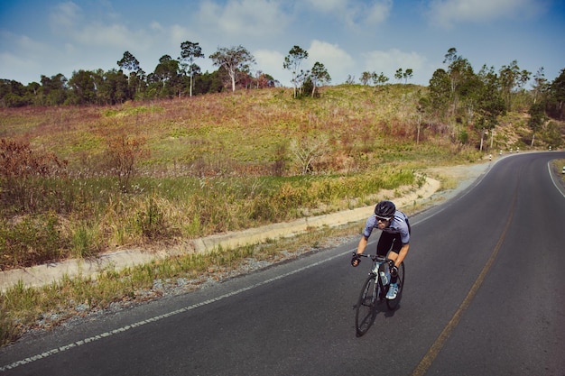 man riding bicycle on road