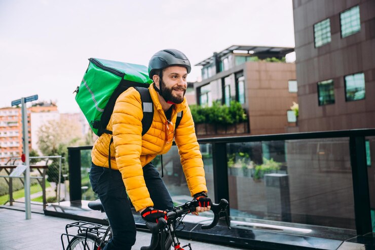 Photo man riding bicycle on street in city