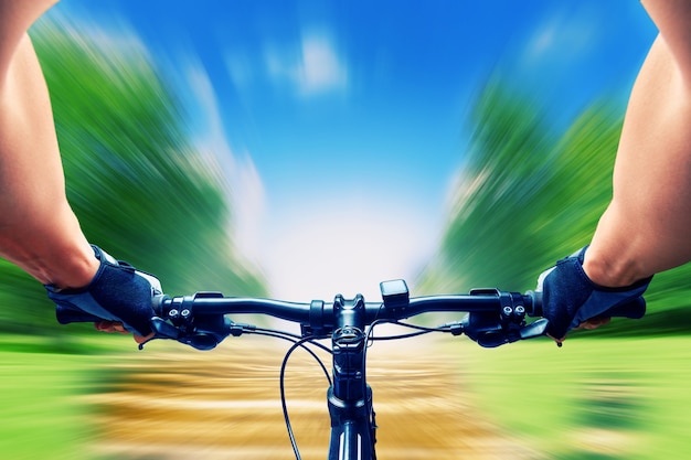 Man riding on a bicycle very fast, motion blur