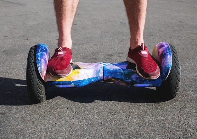 Man riding hoverboard, city