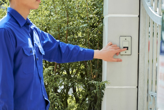 Man ringing in doorbell