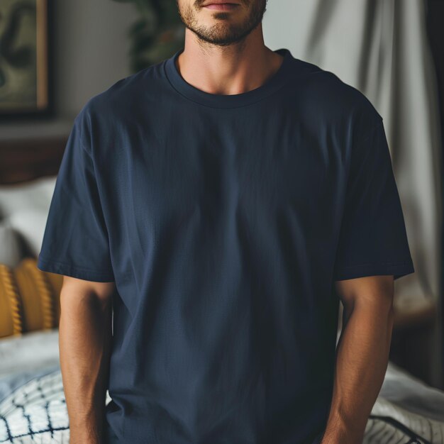 Man in room wearing navy t shirt and shorts