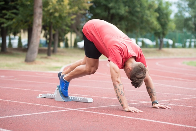 Man Runner Getting Ready to Start Sprinting Run