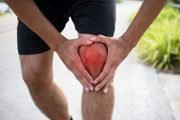 Man Runner Jogging lijdt aan een ongeval Knee