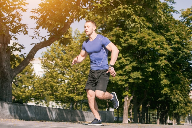 Man running in park at morning. Healthy lifestyle concept