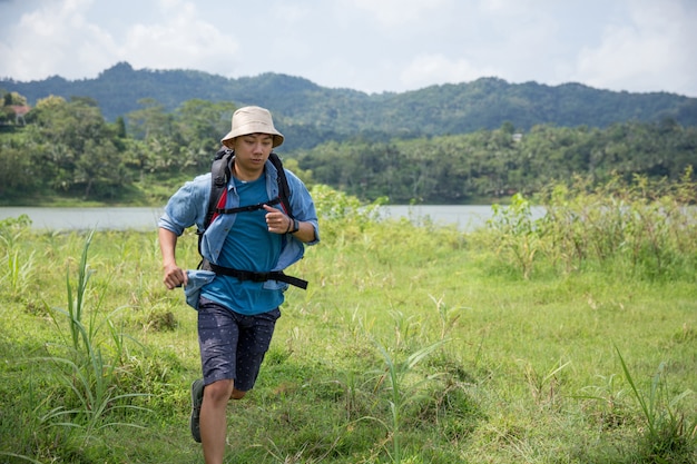 Man running while hiking in outdoor