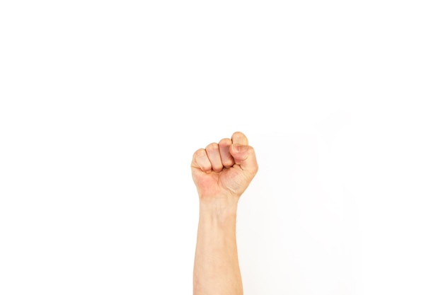 Photo man's arm with clenched fist on a white background with copy space