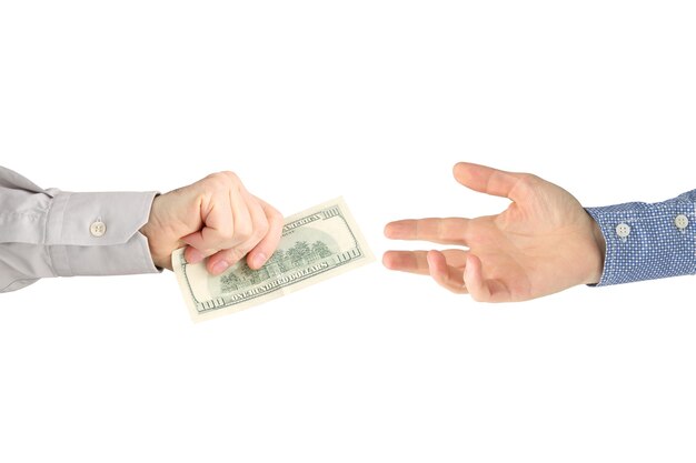 man's hand gives dollar bills to other people. business and finance.