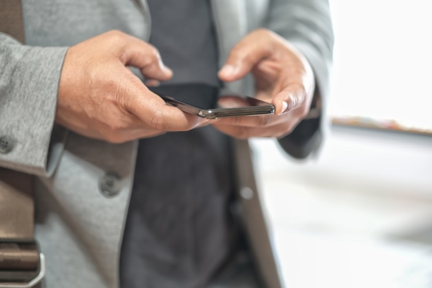 Man's hand using cellphone