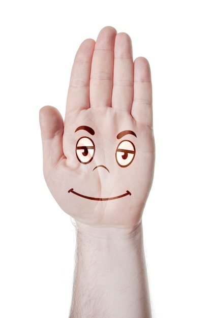 감정적인 얼굴의 패턴이 있는 열린 손바닥을 가진 남자의 손
