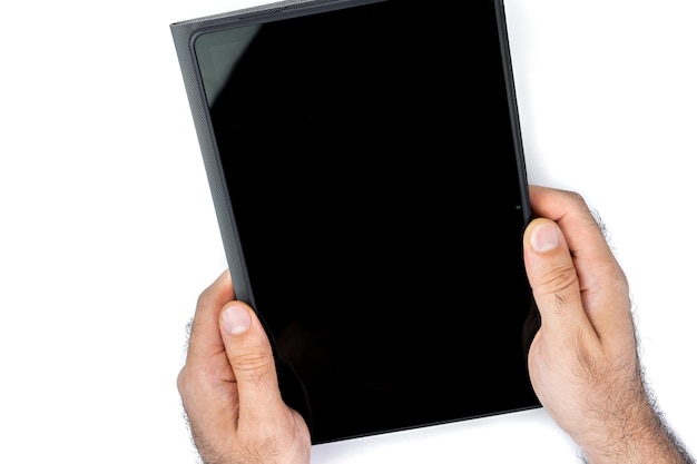 Man's hands holding a tablet on a white background