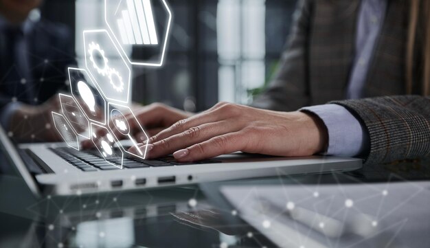 Man's hands typing on laptop keyboard in interior