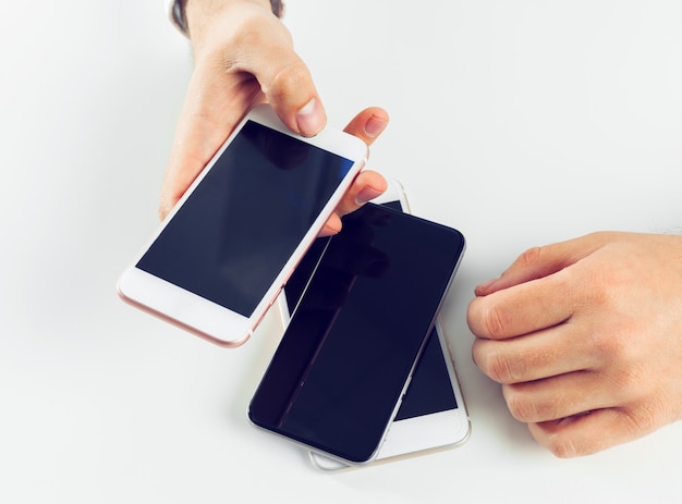 Man's hands using smartphone