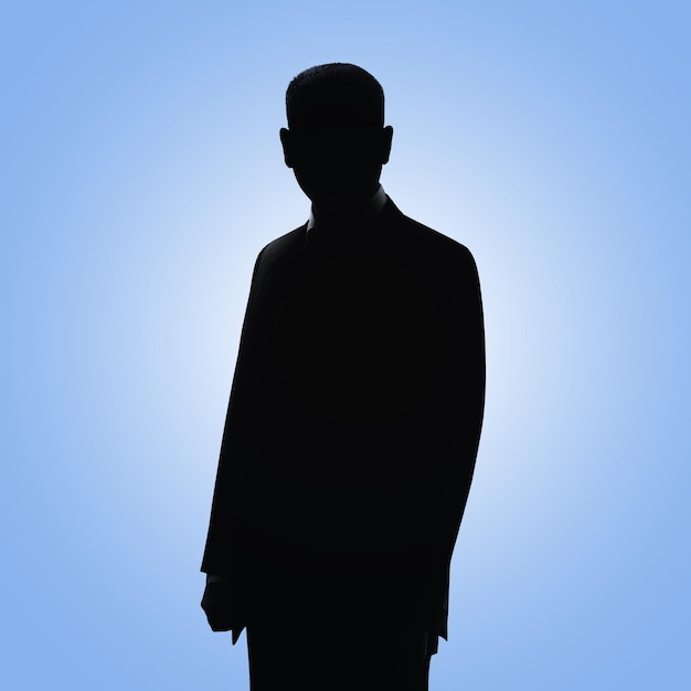 Photo man's silhouette businessman's profile picture man posing in suit on blue background