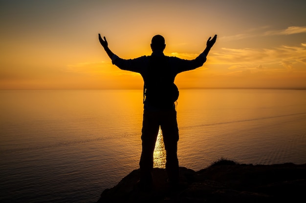 Man's silhouette at the sunset